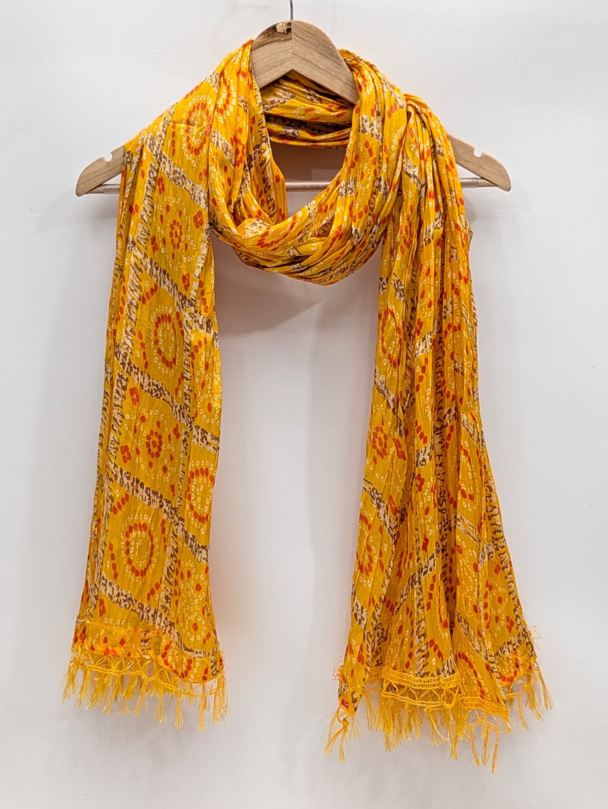 Yellow ethnic motif stole with tassels