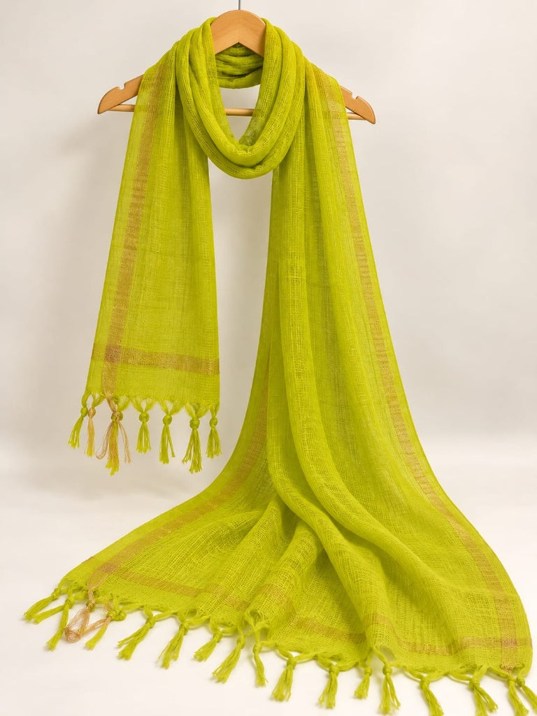 Lime green plain Kota Doriya dupatta featuring a square mesh weave, woven gold border, and decorative tassels